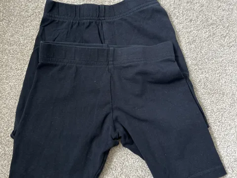 2 girls black mid length shorts
