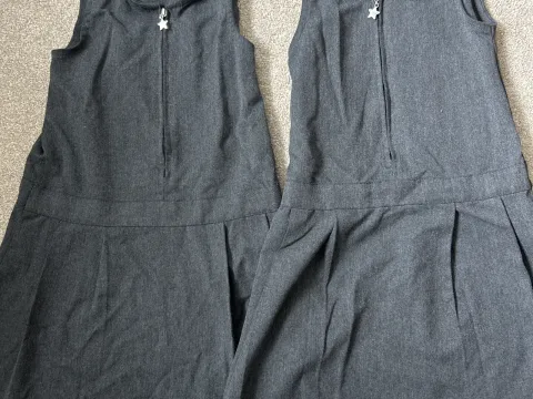 2 x F&F pleated grey school dresses. Age 4-5