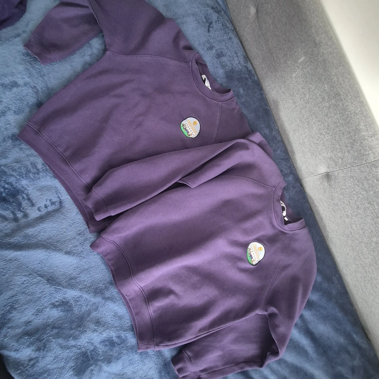Purple jumper with badge