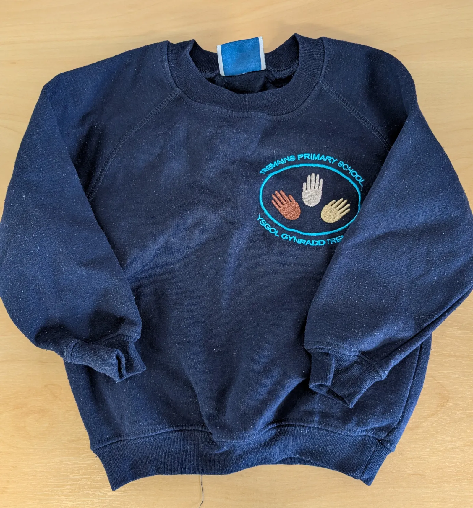 Navy badged school jumper aged 2-3