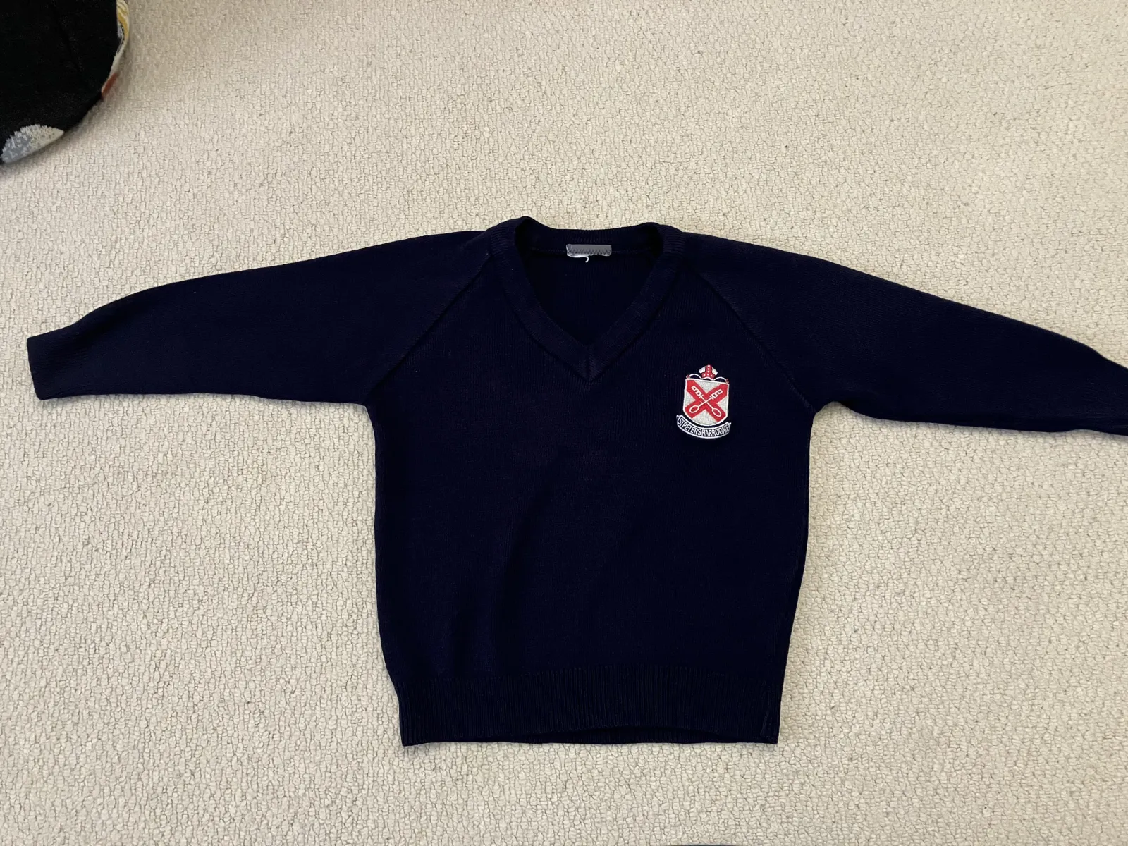 Navy school jumper with logo