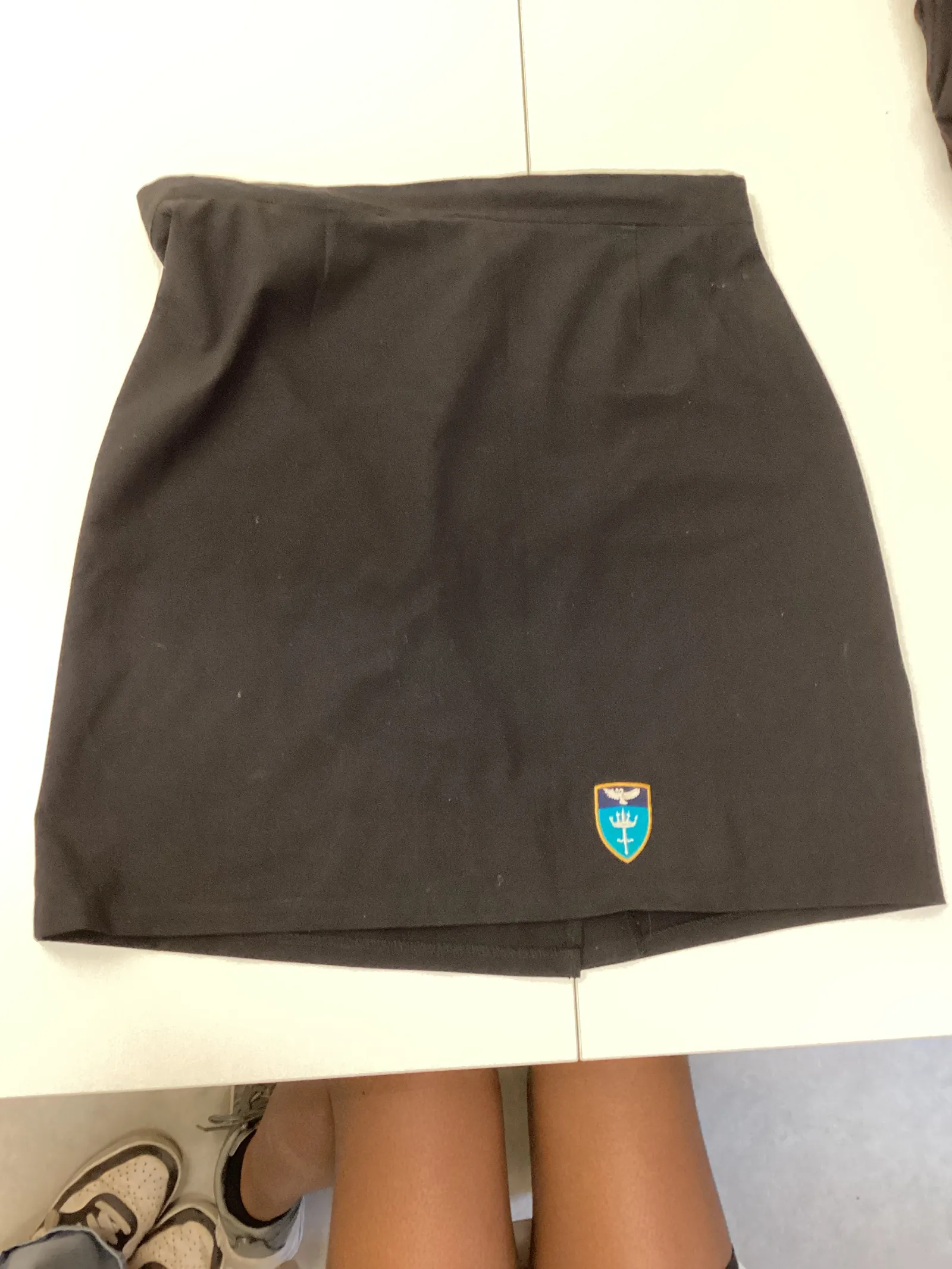 Black, straight school badged skirt