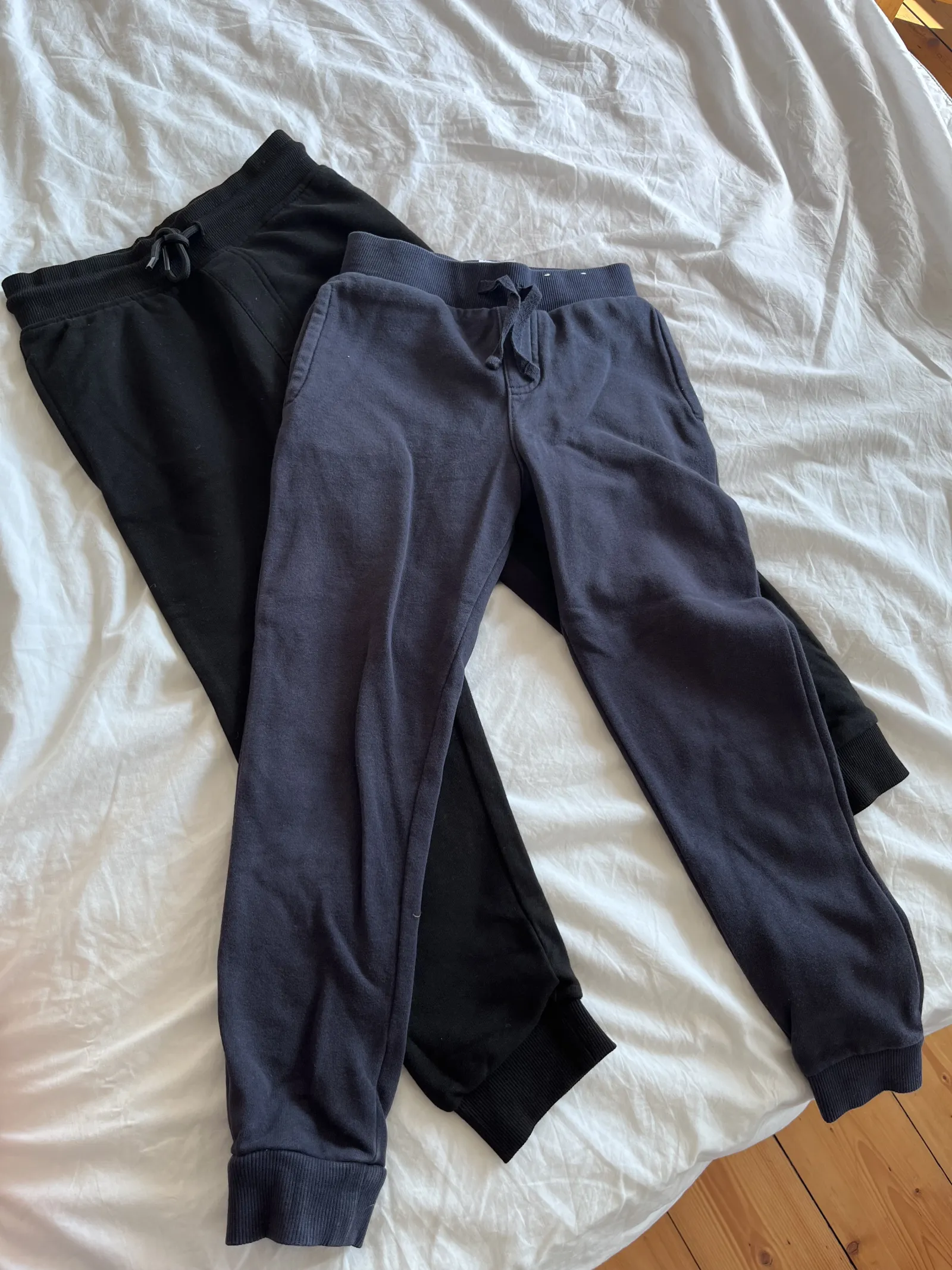One pair navy/one pair black joggers for PE. Age 6-7 years