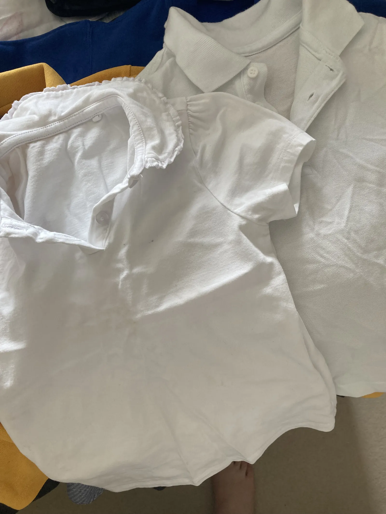 White Polo tops (one with frill collar)