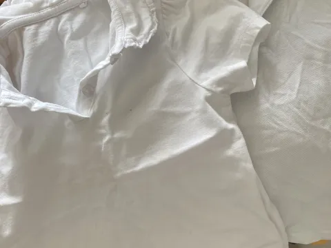 White Polo tops (one with frill collar)